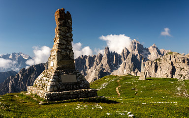 Angel statue and obelisk on the plateau of the tre cime di lavadero with view of the cadini di misurina