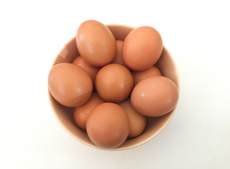 Eggs: brown eggs in separate cups on a white background in close-up shot from top to bottom Thailand