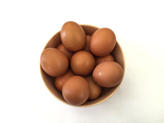 Eggs: brown eggs in cups, separate on a white background in Thailand