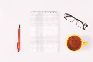 Blank diary, pen, cup of coffee and glasses on white table