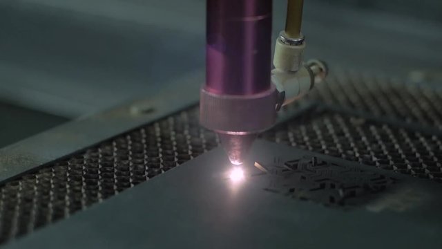 Close up of industrial lase cutting paper process 
