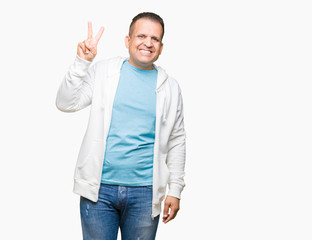 Naklejka premium Middle age arab man wearing sweatshirt over isolated background showing and pointing up with fingers number two while smiling confident and happy.