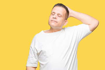 Middle age arab man wearig white t-shirt over isolated background Smiling confident touching hair with hand up gesture, posing attractive