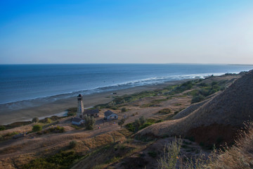 lighthouse in a village by the sea