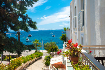 Naklejka premium View of the Bodrum Marina, sailing boats and yachts in Bodrum town, city of Turkey. Shore and coast of Aegean Sea with yachts 