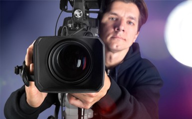 Fototapeta na wymiar Cameraman working with camera isolated