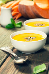 Vegetable or pumpkin soup and ingredients. Warm and comfy autumn concept.
