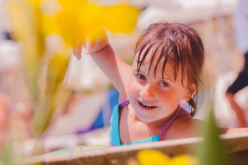 Laugh is the biggest indicator of a kid’s happiness. Cute little child girl having fun in...