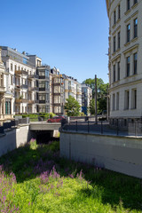 The river Elstermühlgraben in Leipzig with beautiful restored historic residential buildings at...