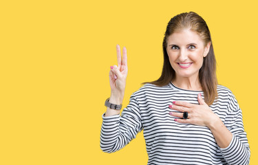 Middle age mature beautiful woman wearing stripes winter sweater over isolated background Swearing...