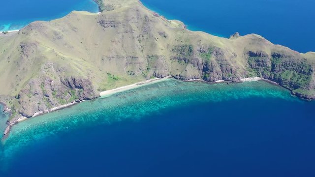A beautiful coral reef fringes the scenic island of Gili Banta just outside of Komodo National Park. This area of Indonesia is known for its spectacular tropical marine biodiversity.