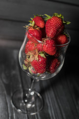 Strawberries in a glass on a black background