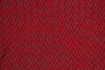 Fototapeta premium Large knitted red Jersey closeup background texture.
