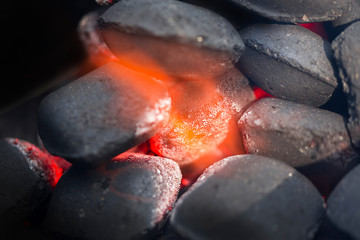 Hot charcoal briquettes for grilling