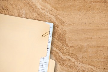 Manila folder with some documents in it. on a white background