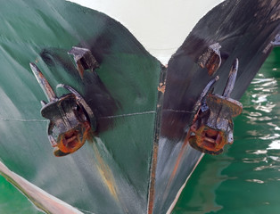anchor of a ship at the outside of the hull