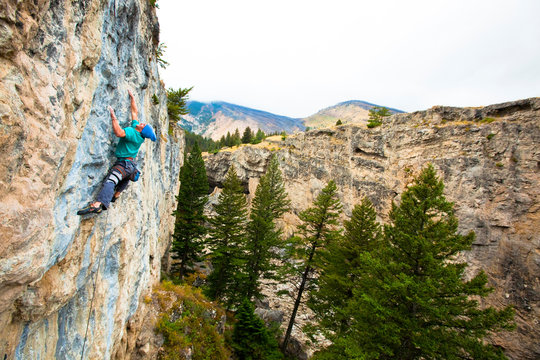 A climber whips out some awesome english on Isla de los Locos (5.13c) at Natural Bridge State Park.