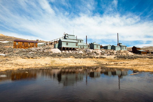 The old mill reflects off of a pond at the Bodie gold mining ghost town in California.