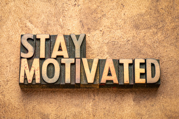 stay motivated word abstract in wood type