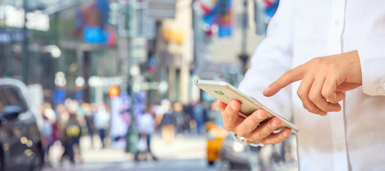 Businessman holding a smartphone