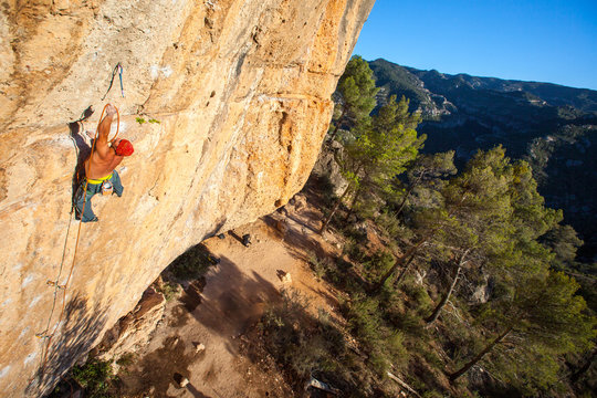 Kyle Vassilopoulos on Telemaster (8a/5.13b) at the Raco de les Espadelles sector at Margalef, Spain at sunset.