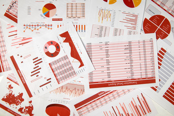 Flat top view of business workspace - reports with data, tables and analytic chart. Business...