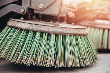 Close-up sweeper machine cleaning. Concept clean streets from debris