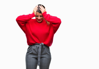 Fototapeta premium Young beautiful business woman wearing winter sweater over isolated background suffering from headache desperate and stressed because pain and migraine. Hands on head.