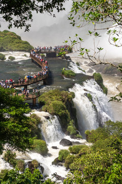 Beautiful landscape of tourists visiting big waterfalls on rainforest