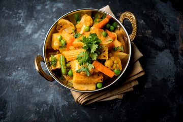 Mix vegetable curry - Indian main course recipe contains Carrots, cauliflower, green peas and beans, baby corn, capsicum and paneer/cottage cheese with traditional masala and curry, selective focus