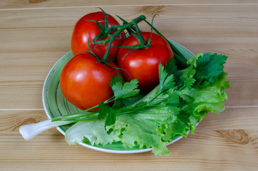  tomatoes on a bowl with lettuce