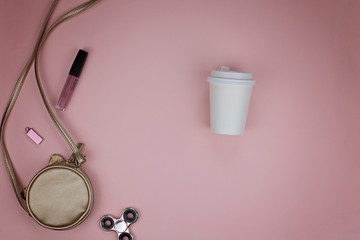 Layout for presentations paper cup, women's handbag and stuff from it. View from above. Modern trend template for advertising.