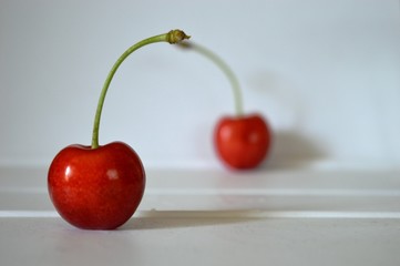 mature red delicious and sweet cherries