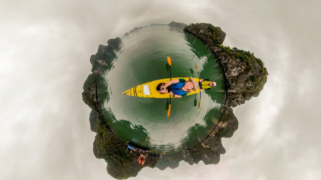 Couple kayaking Ha Long Bay