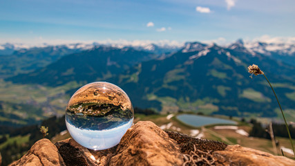 Crystal ball alpine landscape shot at Hohe Salve summit - Söll - Tyrol - Austria