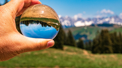 Crystal ball alpine landscape shot at Hohe Salve summit - Söll - Tyrol - Austria