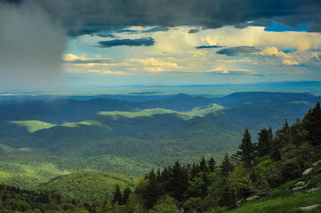 Fototapeta na wymiar Gorgeous view of the North Carolina mountains showing clouds hovering above the peaks