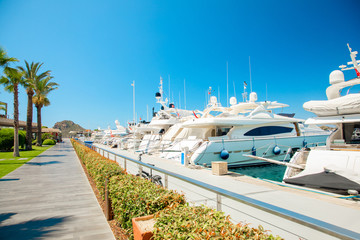 Fototapeta premium View of the Bodrum Marina, sailing boats and yachts in Bodrum town, city of Turkey. Shore and coast of Aegean Sea with yachts 