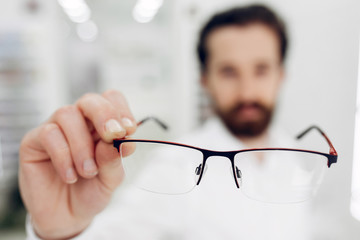 Man in a glasses. Guy in a optics shop