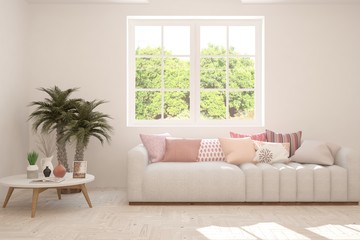 Stylish room in white color with sofa and summer landscape in window. Scandinavian interior design. 3D illustration