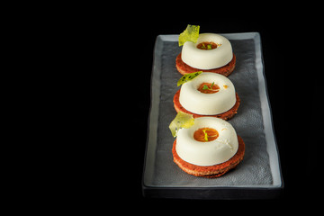 three shortbread cookies with white mousse cream and jam