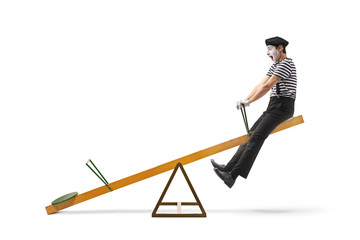 Mimic swinging on a seesaw and making a grimace