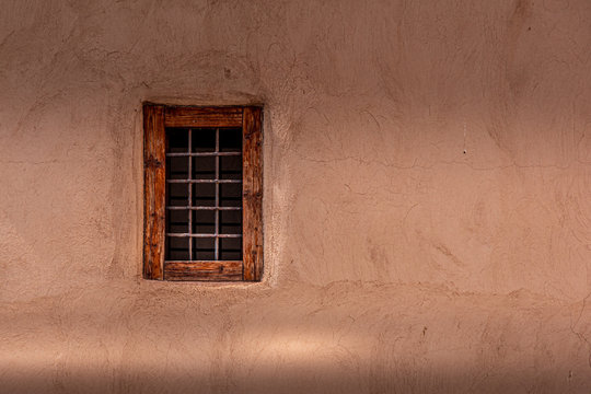 Close up view of a small traditional window on the wall made of mud. Marrakesh, Morocco.