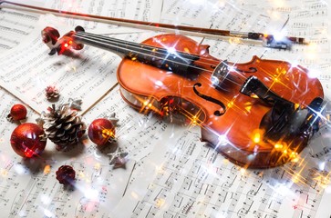 Close-up Photo Of Violin, Musical Notes and Christmas decoration © BillionPhotos.com