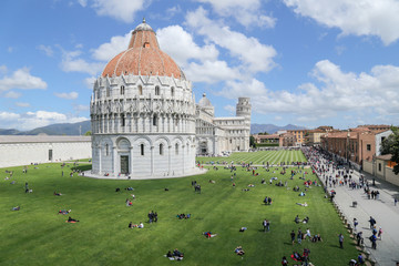 wide view of Piazza dei Miracloli in Pisa with the baptistry the cathedral and the leaning tower