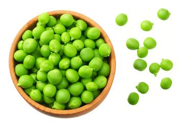 fresh green peas in a wooden plate isolated on a white background. top view