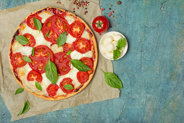 Pizza margarita with tomato, mozzarella cheese and basil