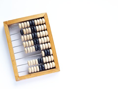 Education, training and account concept. Old wooden abacus on pure white background.