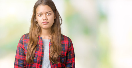 Young beautiful brunette woman wearing a jacket over isolated background Relaxed with serious expression on face. Simple and natural looking at the camera.