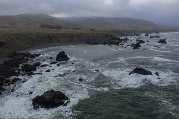 Fototapeta premium The cold, nutrient-rich waters of the Pacific Ocean wash against the rugged yet scenic coastline of Northern California. This area is easily accessible from the famous California route 1.
